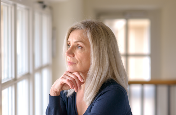 Woman looking out window