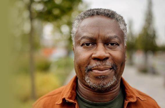 An old man smirking