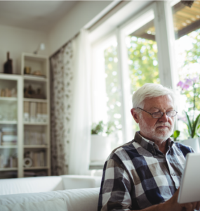 Senior with tablet