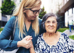 Mother and daughter holding hands