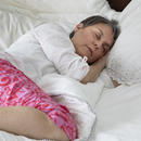 Woman sleeping in a bed